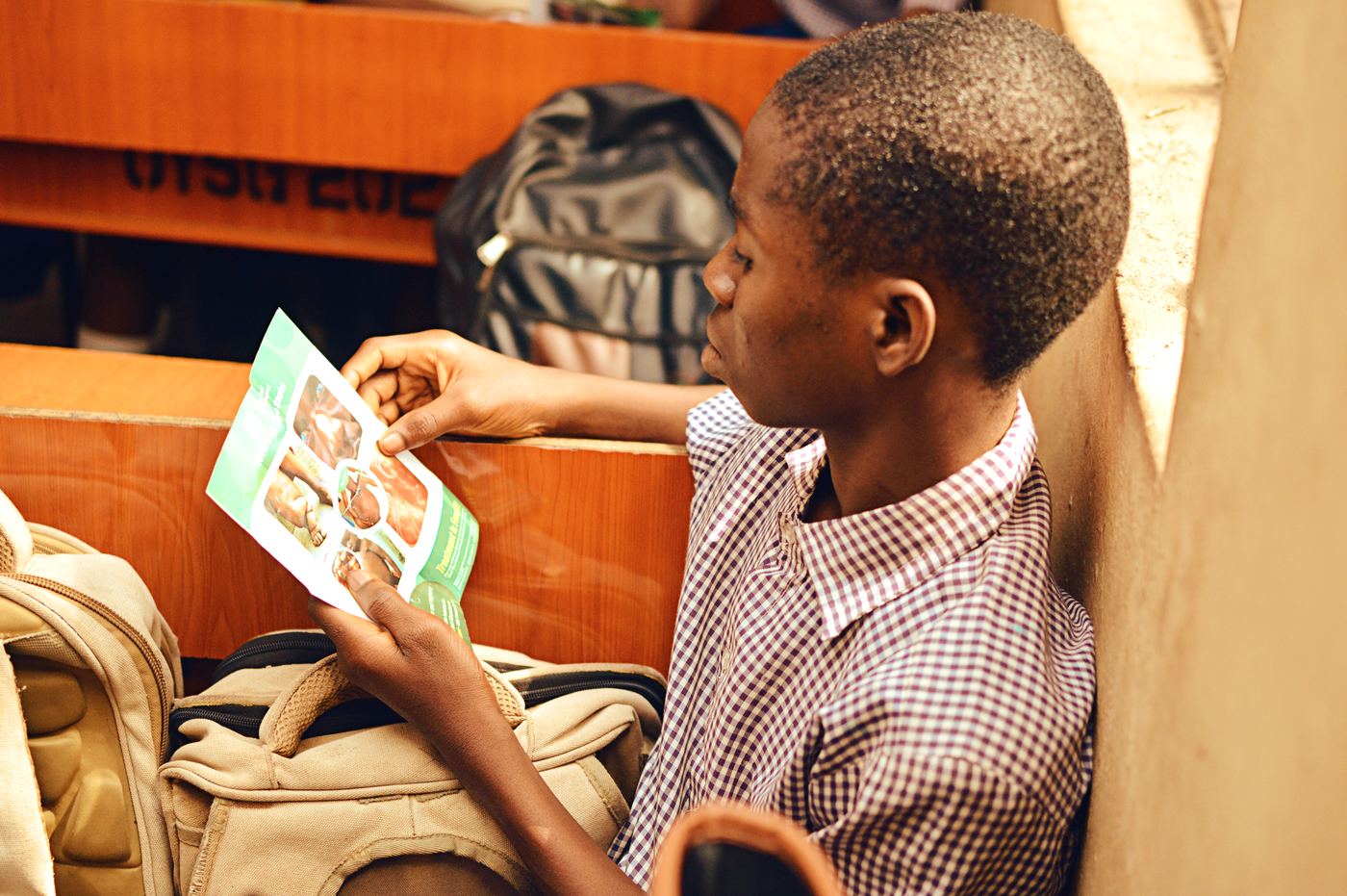 Student reading a health pamphlet